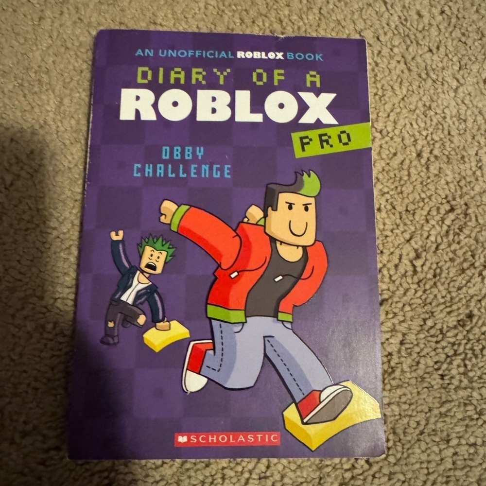 Scholastic Roblox Diary of a Pro - Purple and Red Cover